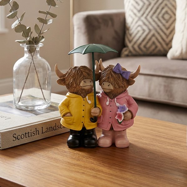 HIGHLAND COWS WITH UMBRELLA